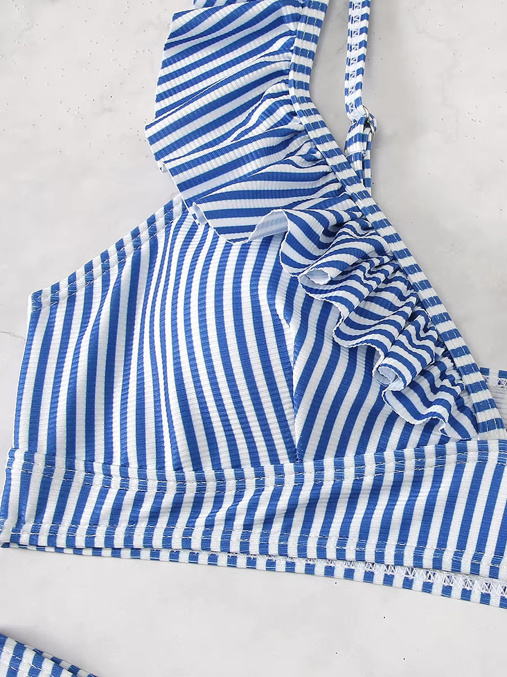 Blue and white striped bikini top with ruched side detail and adjustable straps