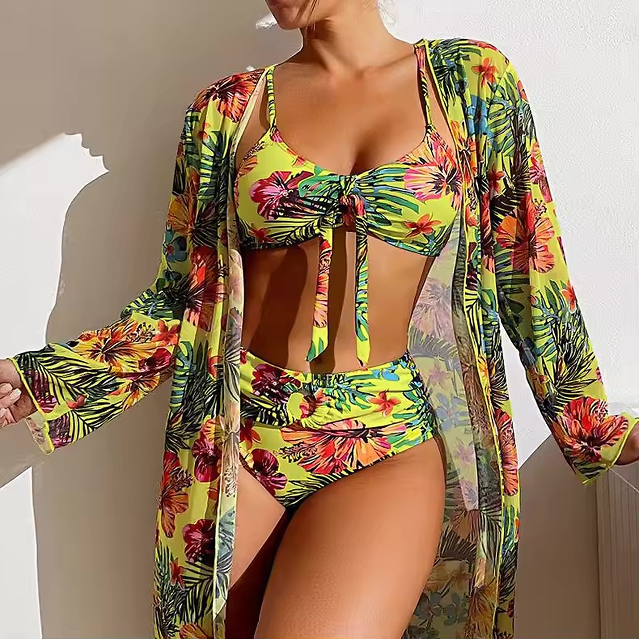 Vibrant tropical floral bikini set with matching cover-up kimono in yellow, pink, and green tones.