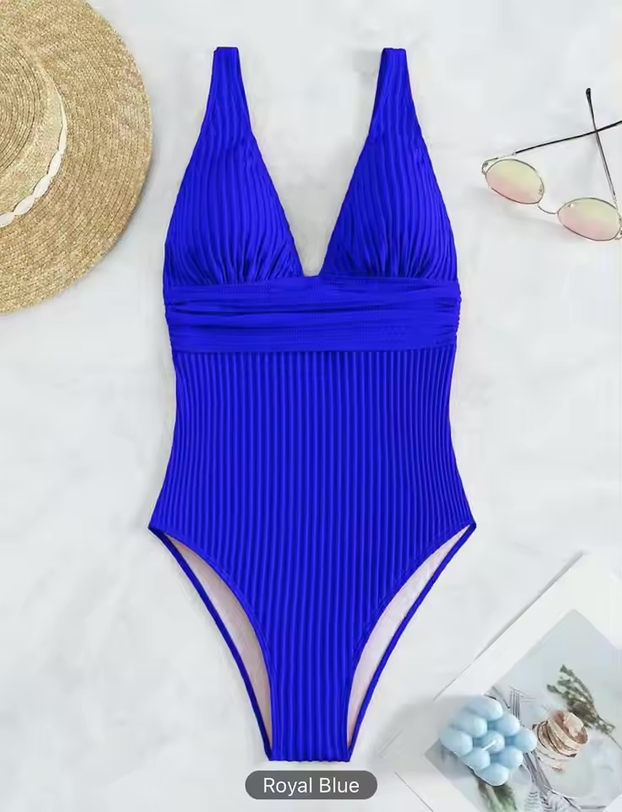 Royal blue ribbed bikini with plunging neckline and ruched waist detail for a flattering fit.