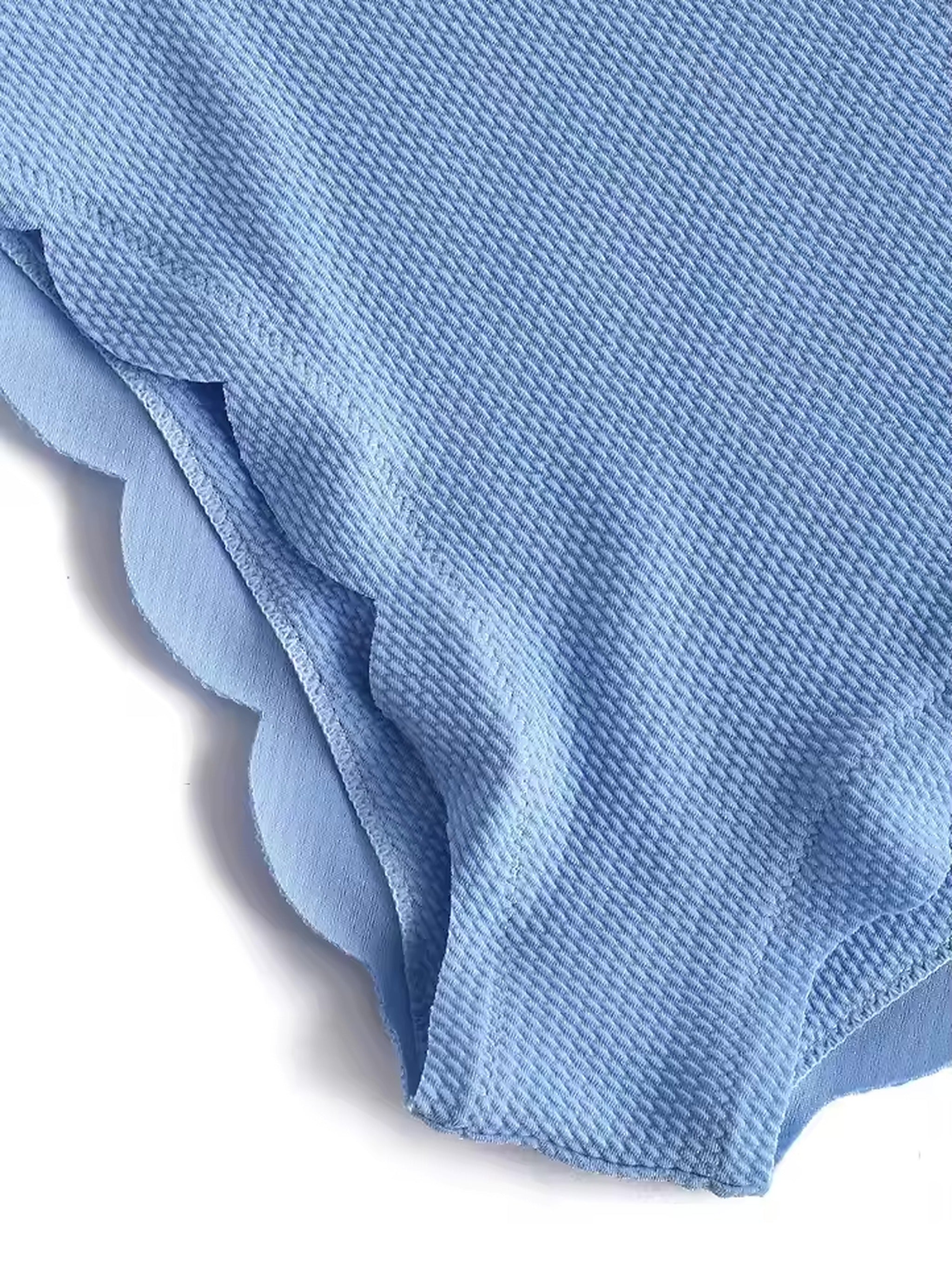 Light blue textured bikini with ruffled edge detail and diagonal rib knit fabric pattern